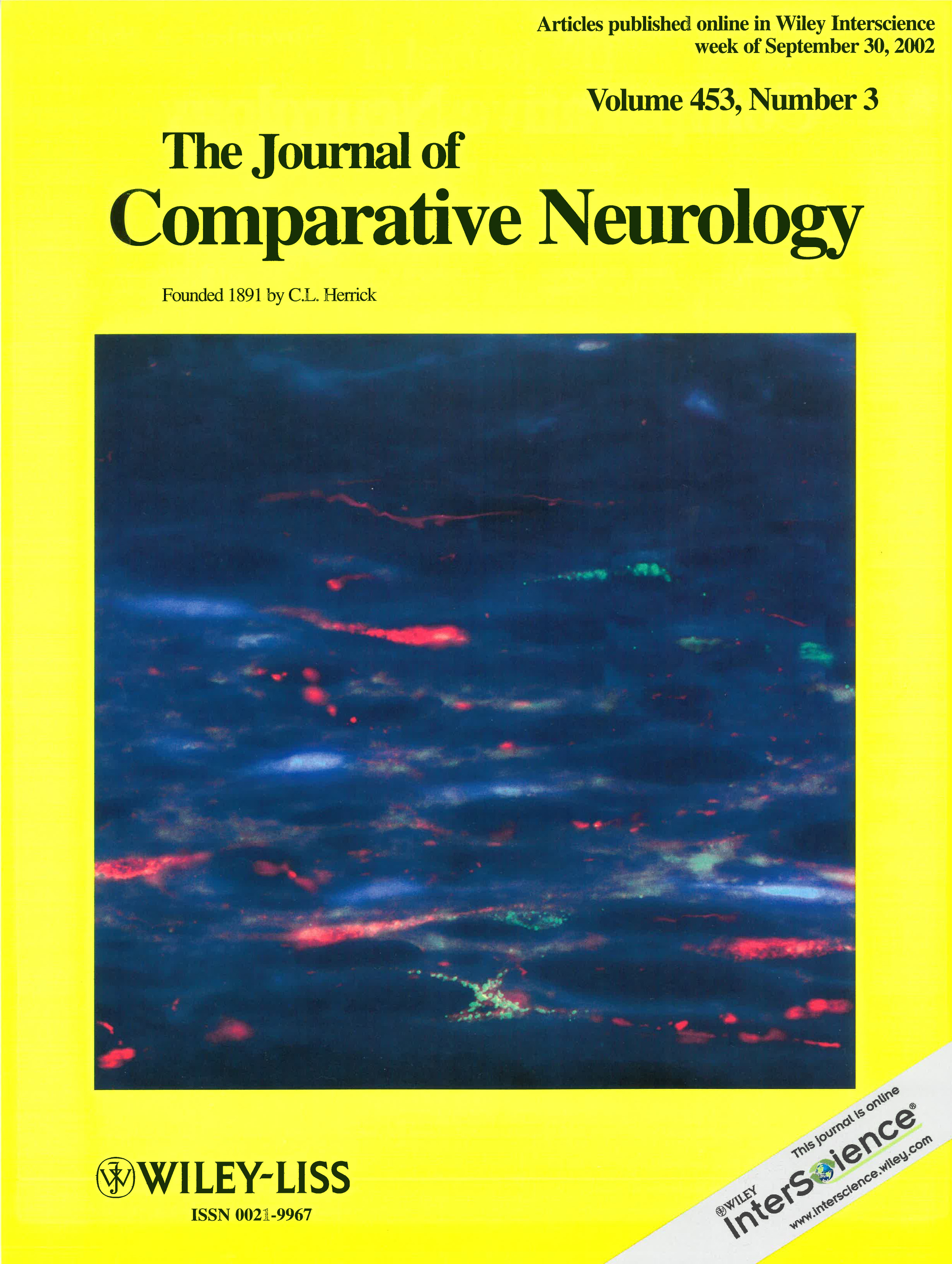 Cover of The Journal of Comparative Neurology, Volume 453, Number 3, yellow background with a large microscope image of red and green labeled neurons